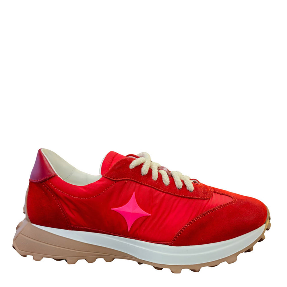 Red sneaker with a pink star on a white background