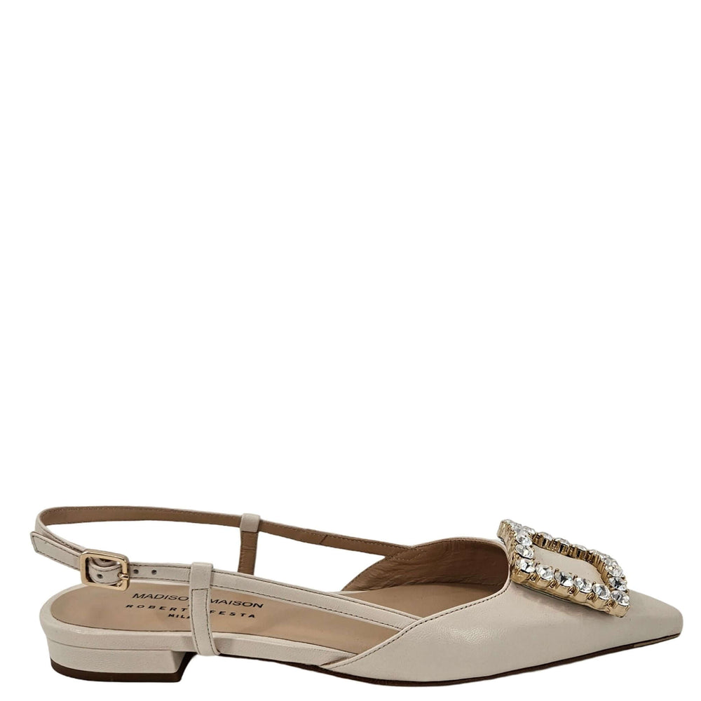 Beige sandal with a decorative strap on a white background
