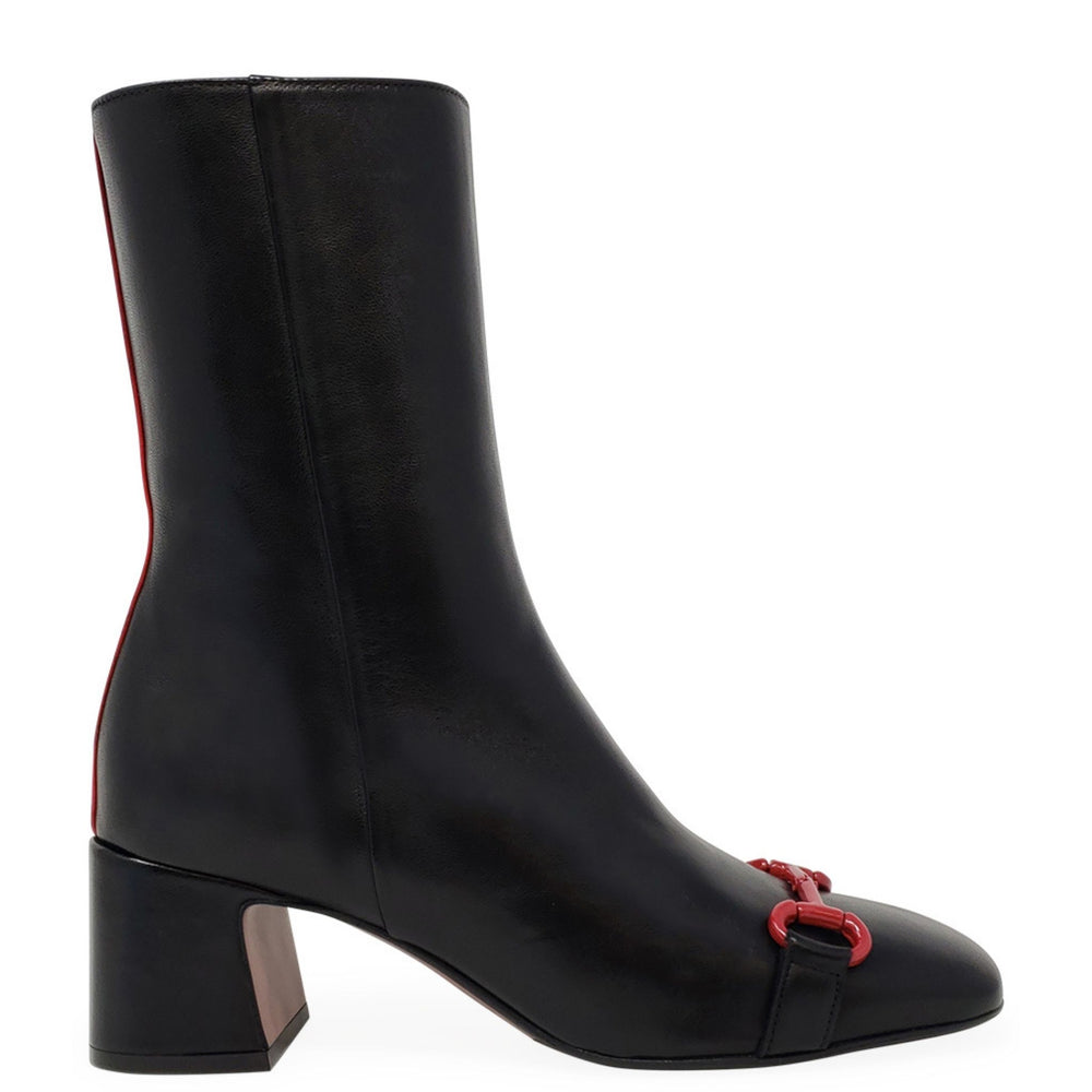 Black ankle boot with red accents on a white background