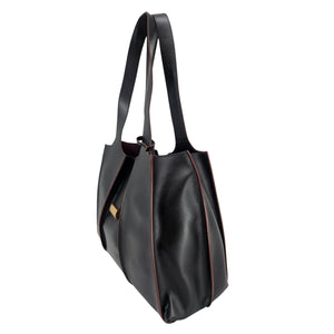 A sleek, black polished leather handbag with a wide opening, two top handles, and a horizontal gold bar accent on the front.
