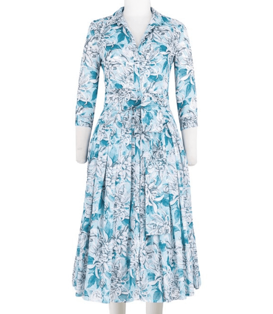 A knee-length dress with a collared neckline, three-quarter sleeves, and a flared skirt. Features a bold allover abstract pattern and fitted waist.
