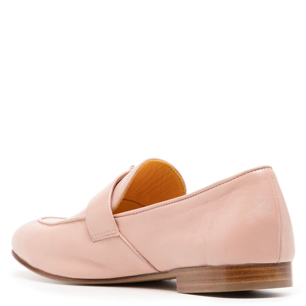 Pink loafer shoe with a brown sole on a white background