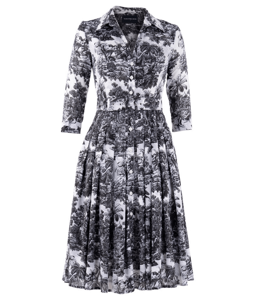 A knee-length dress with a collared neckline, three-quarter sleeves, and a flared skirt. Features a bold allover abstract pattern and fitted waist.