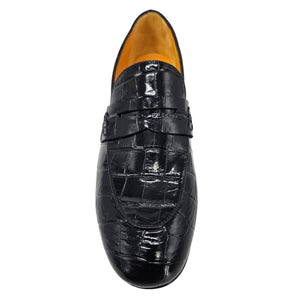 Black crocodile-patterned loafer shoe on a white background