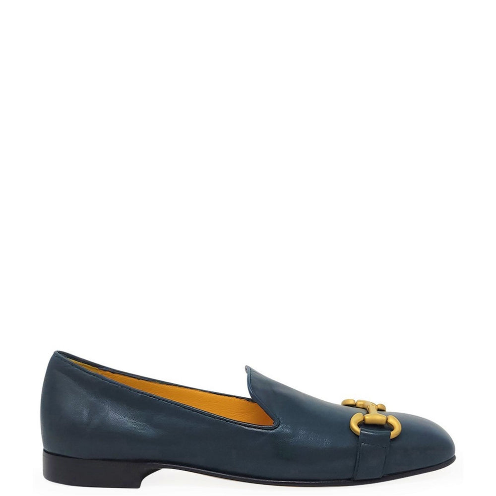 Blue loafer with a gold buckle on a white background