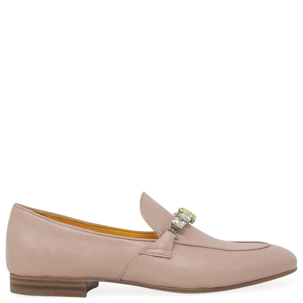 Pink loafer with a decorative buckle on a white background