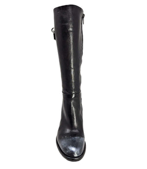 Tall leather boot featuring a softly rounded toe, mid-height stacked block heel, full side zipper for easy on and off, and a decorative metal lock accent near the top shaft. Crafted from premium leather with artisanal distressed detailing at the toe and h
