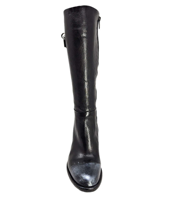 Tall leather boot featuring a softly rounded toe, mid-height stacked block heel, full side zipper for easy on and off, and a decorative metal lock accent near the top shaft. Crafted from premium leather with artisanal distressed detailing at the toe and h