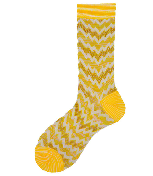 A mid-calf knit sock featuring a mix of textured panels, ribbed leg section, and bold horizontal stripes around the arch and cuff.