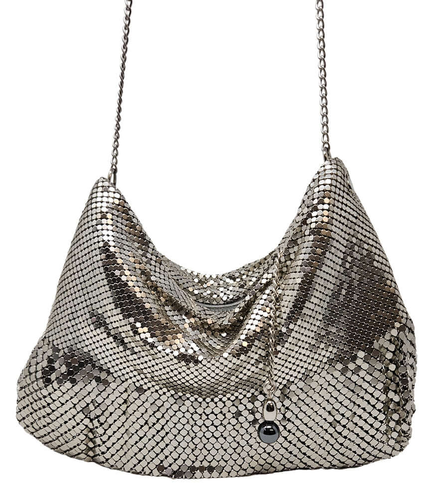 "Small chainmail mesh shoulder bag with a soft, slouchy silhouette, fine metal disc overlay, and a delicate chain strap. Features a gathered top opening with a decorative metal charm detail. Lightweight design ideal for evening or special occasions. Craft