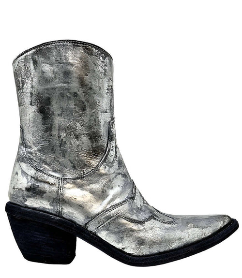 Mid-calf western-style boot featuring a distressed silver metallic finish, pointed toe, angled block heel, and contrast stitching. Designed with decorative panel overlays and a side zipper closure - side view