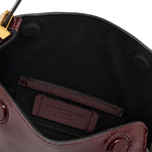 Close-up of a black interior of a handbag with a visible brand label.