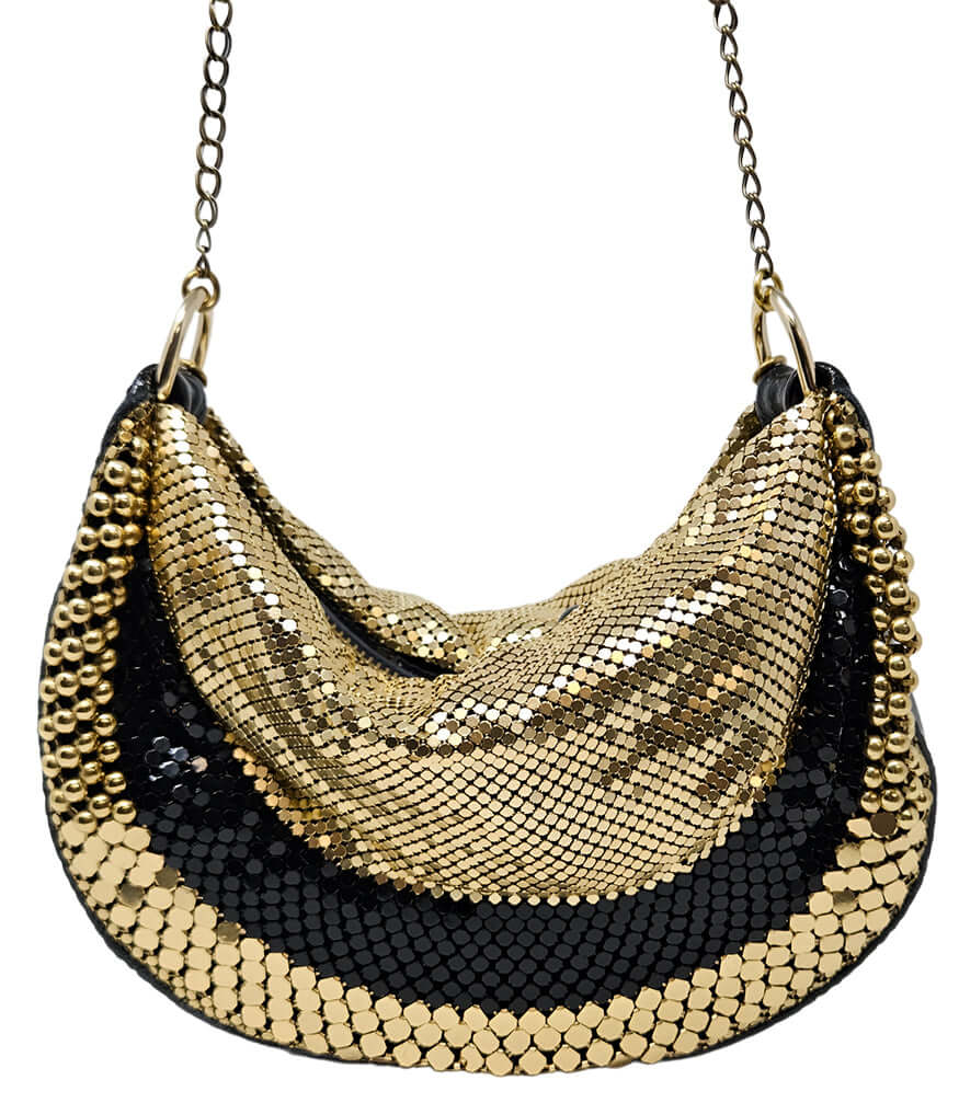 A metallic hobo-style handbag with a black and silver mesh design, accented by large silver beaded trim along the edges. The bag hangs from a silver chain strap and features a soft, slouchy silhouette. Designed by Madison in Beverly Hills