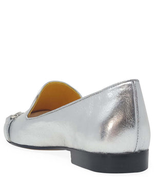 leather loafer with a rounded toe and flat sole, featuring a metal horsebit-style detail across the front. Designed by Madison in Beverly Hills and handcrafted in Italy.