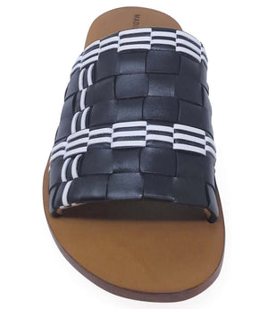 Handmade Italian slide sandal featuring a wide woven upper with interlaced detailing and a flat leather sole. Shown from side and front angles against a clean background.