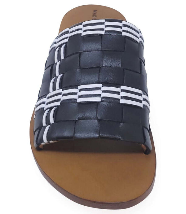 Handmade Italian slide sandal featuring a wide woven upper with interlaced detailing and a flat leather sole. Shown from side and front angles against a clean background.
