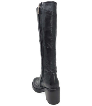 "Knee-high leather boot with structured shaft, rounded toe, and stacked block heel. Designed with minimal stitching and a smooth finish