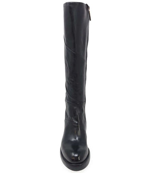 "Knee-high leather boot with structured shaft, rounded toe, and stacked block heel. Designed with minimal stitching and a smooth finish