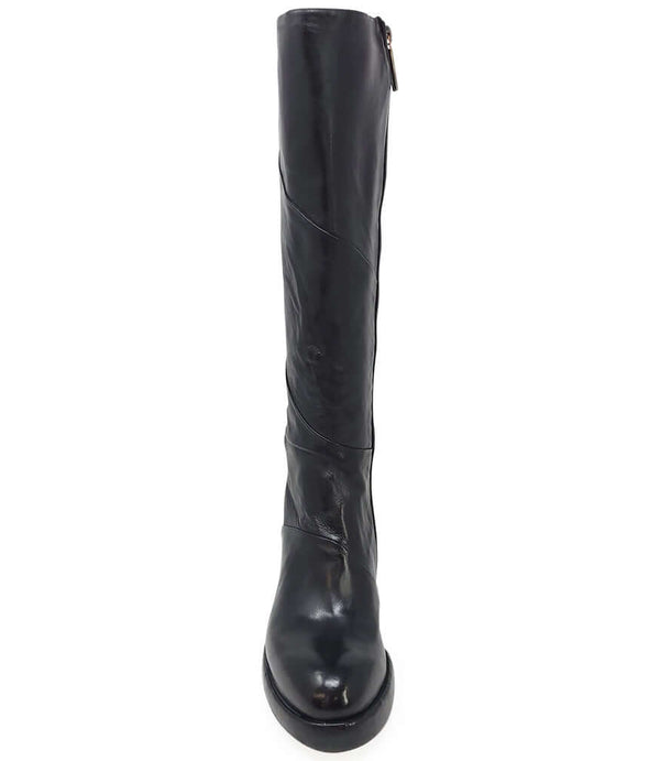 "Knee-high leather boot with structured shaft, rounded toe, and stacked block heel. Designed with minimal stitching and a smooth finish