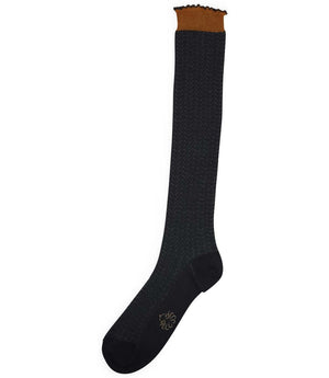 A mid-calf knit sock featuring a mix of textured panels, ribbed leg section, and bold horizontal stripes around the arch and cuff.