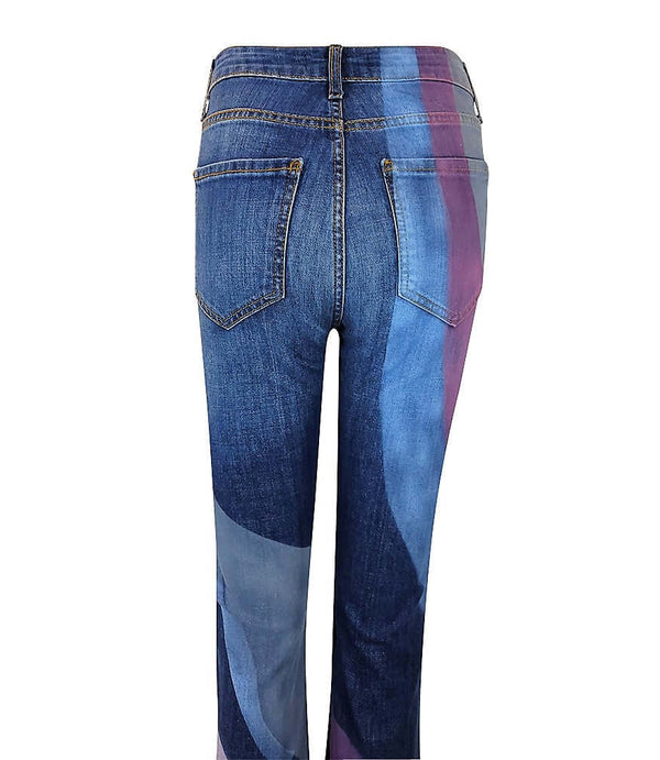 Women's high-rise flared jeans made in Italy from premium stretch denim, featuring abstract panel detailing on the legs and a tailored fit through the hip and thigh for a flattering silhouette.