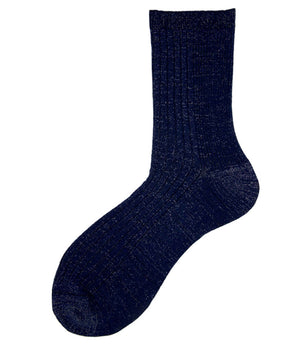 A mid-calf knit sock featuring a mix of textured panels, ribbed leg section, and bold horizontal stripes around the arch and cuff.