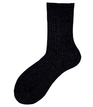 A mid-calf knit sock featuring a mix of textured panels, ribbed leg section, and bold horizontal stripes around the arch and cuff.