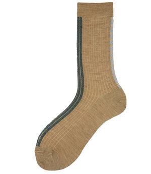 A mid-calf knit sock featuring a mix of textured panels, ribbed leg section, and bold horizontal stripes around the arch and cuff.