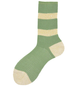 A mid-calf knit sock featuring a mix of textured panels, ribbed leg section, and bold horizontal stripes around the arch and cuff.