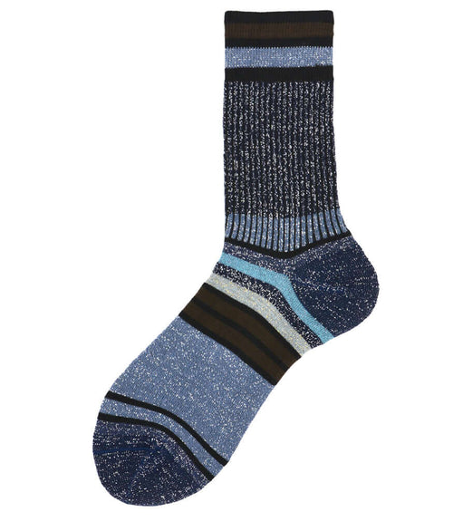 A mid-calf knit sock featuring a mix of textured panels, ribbed leg section, and bold horizontal stripes around the arch and cuff.