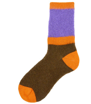 A mid-calf knit sock featuring a mix of textured panels, ribbed leg section, and bold horizontal stripes around the arch and cuff.