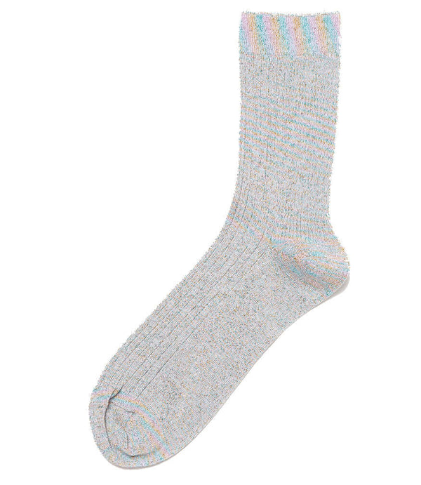 A mid-calf knit sock featuring a mix of textured panels, ribbed leg section, and bold horizontal stripes around the arch and cuff.