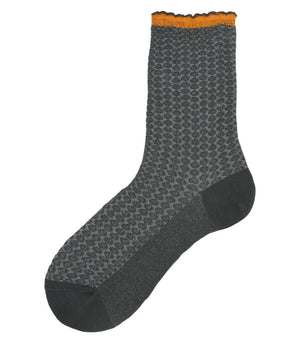 A mid-calf knit sock featuring a mix of textured panels, ribbed leg section, and bold horizontal stripes around the arch and cuff.