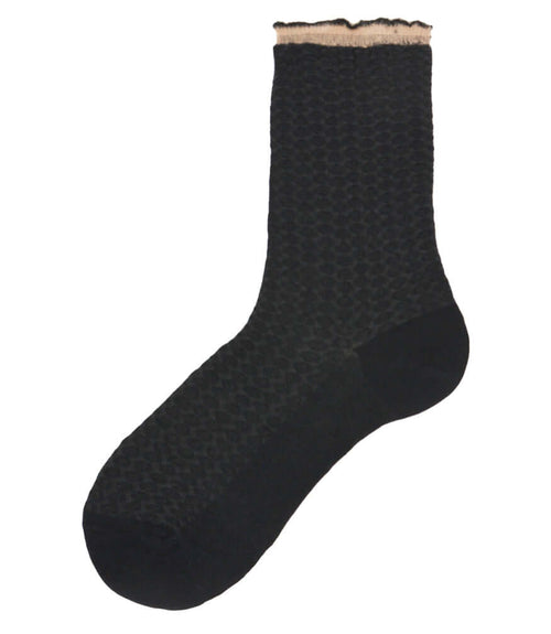 A mid-calf knit sock featuring a mix of textured panels, ribbed leg section, and bold horizontal stripes around the arch and cuff.
