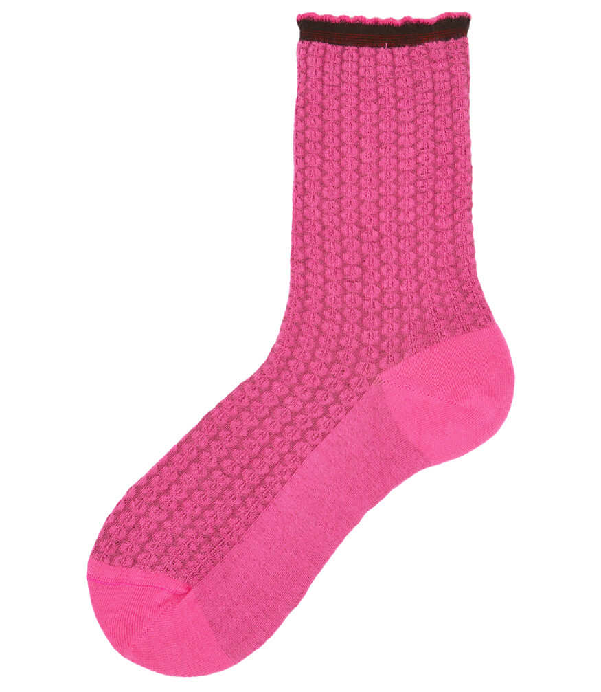 A mid-calf knit sock featuring a mix of textured panels, ribbed leg section, and bold horizontal stripes around the arch and cuff.