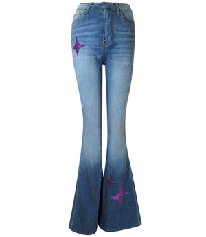 Flared-leg pants made in Italy with a mid-rise fit, featuring front and back pockets and star-shaped accents on the hip, lower leg, and back pocket. Displayed from multiple angles against a clean background