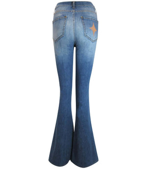 Flared-leg pants made in Italy with a mid-rise fit, featuring front and back pockets and star-shaped accents on the hip, lower leg, and back pocket. Displayed from multiple angles against a clean background