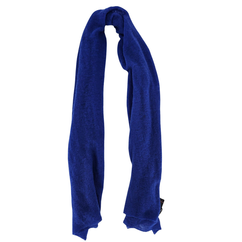 Small cashmere scarf in solid cobalt blue, loosely tied with soft ends