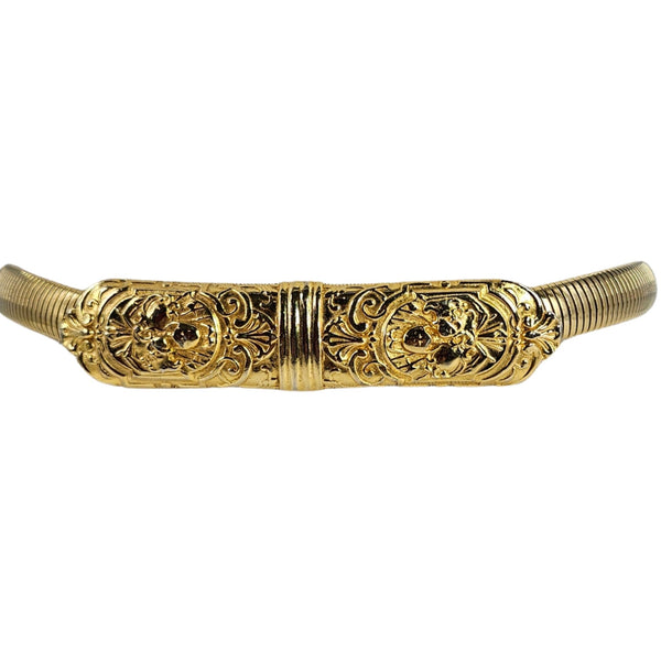 Decorative gold belt buckle on a white background