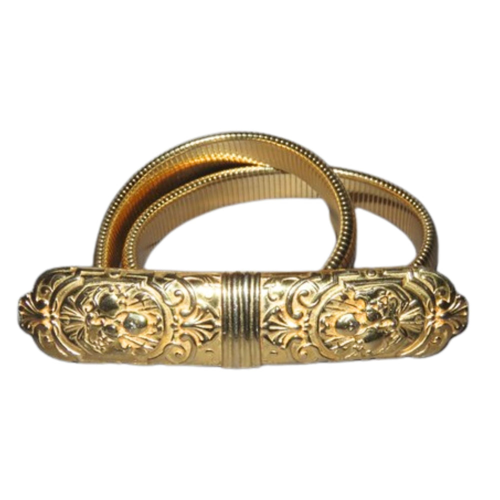 Decorative gold belt buckle on a white background