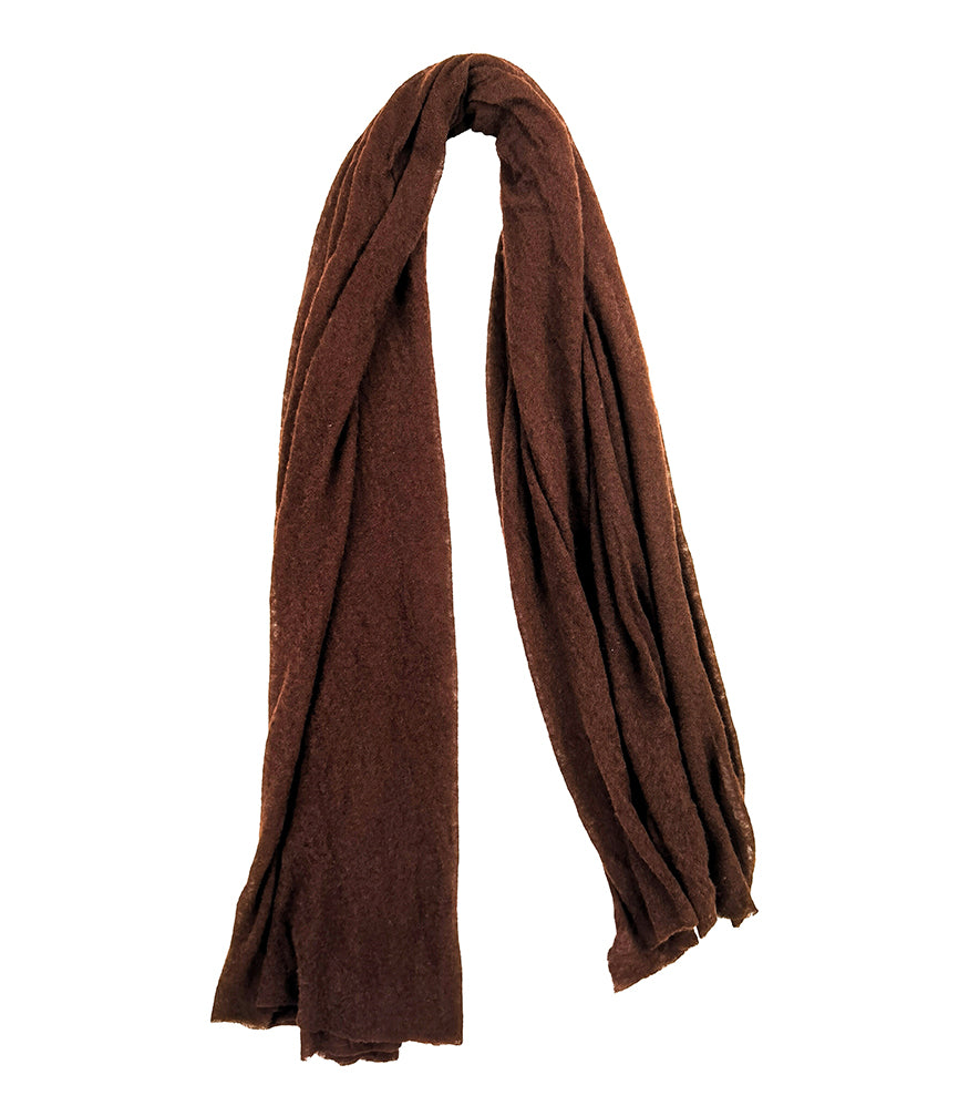 A lightweight, rectangular scarf with soft texture and raw edges, draped to show length and fluidity