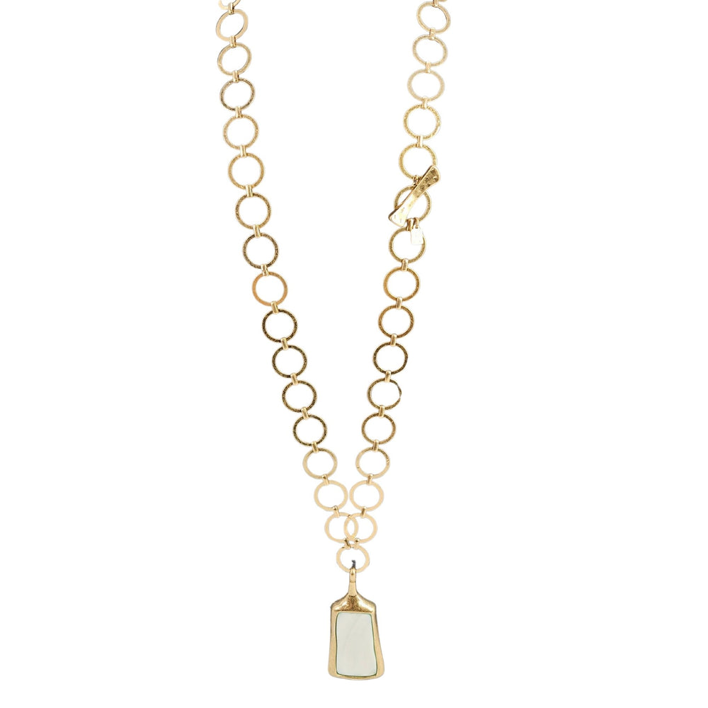 Gold chain necklace with a pendant on a white background