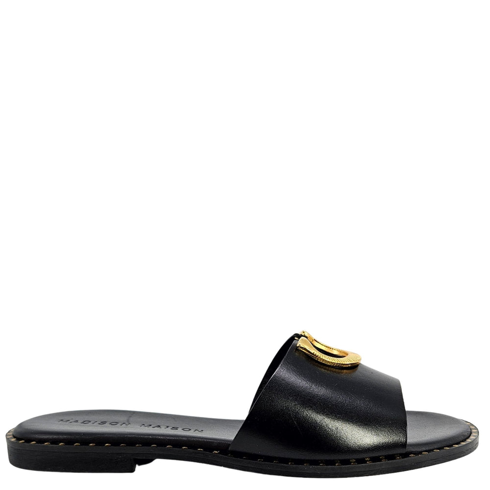 Black sandal with gold buckle on a white background