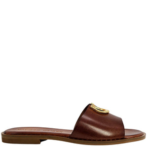 Brown sandal with a gold buckle on a white background