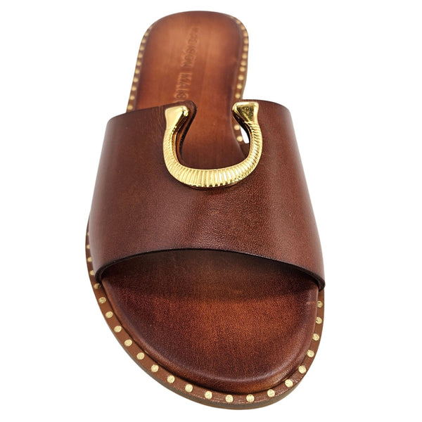 Brown sandal with gold buckle on a white background