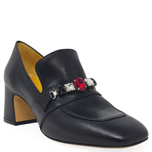 Black shoe with decorative red and silver embellishments on a white background