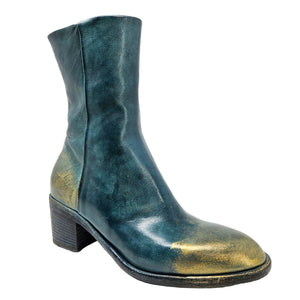 Green leather boot with gold accents on a white background