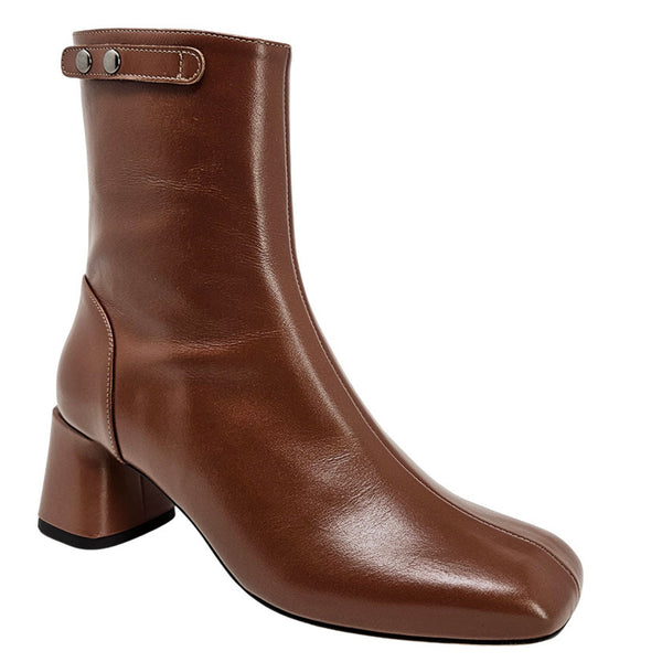 Brown leather ankle boot with a block heel on a white background