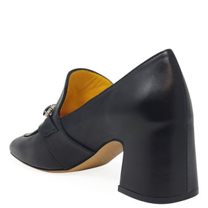 Black shoe with a thick heel on a white background
