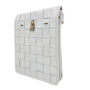White woven clutch bag with a gold lock on a white background